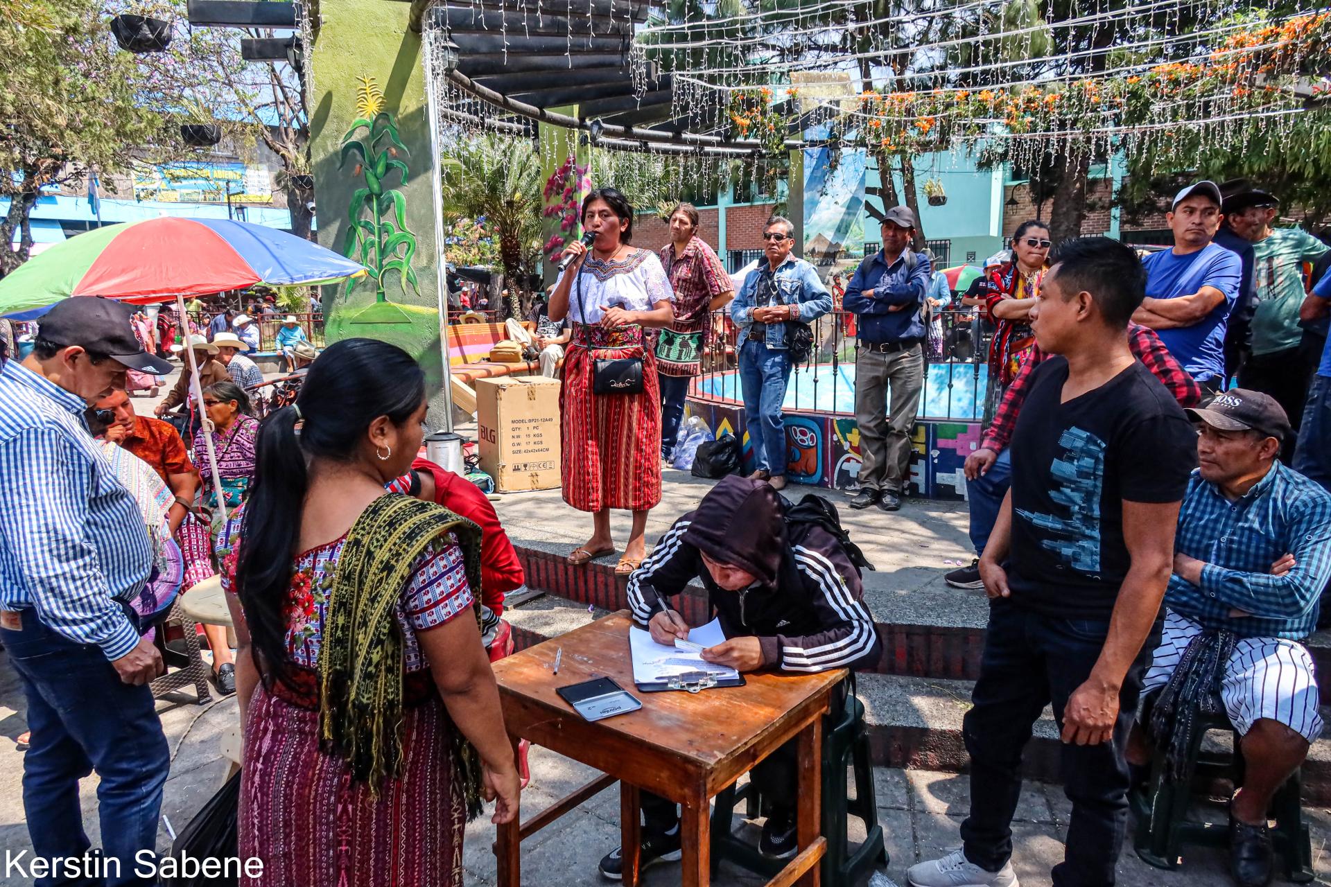 People in Santiago's central park signing a petition on February 15, 2026.jpg
